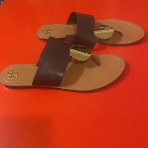 Tory Birch women’s size 11 slides. Dark brown and gold. Excellent condition.